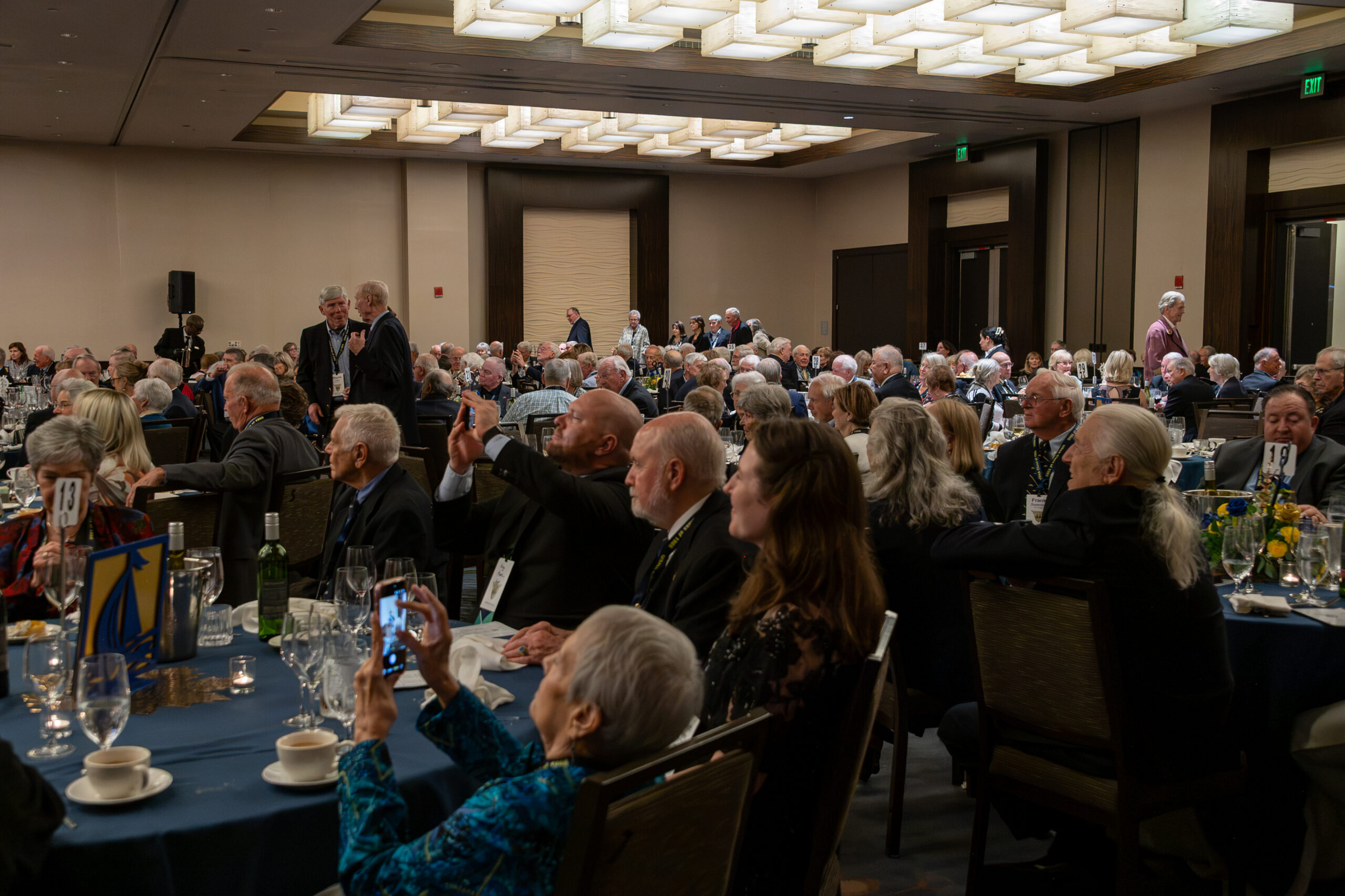 Ballroom filled with Classmates, spouses and guests at round tables during the 60th Reunion Friday night banquet